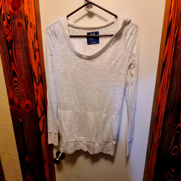 White long sleeve hooded Tee shirt with pocket for hands on front. - Picture 1 of 5